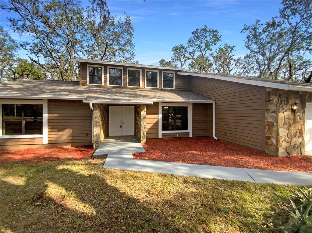 front view of a house with a yard