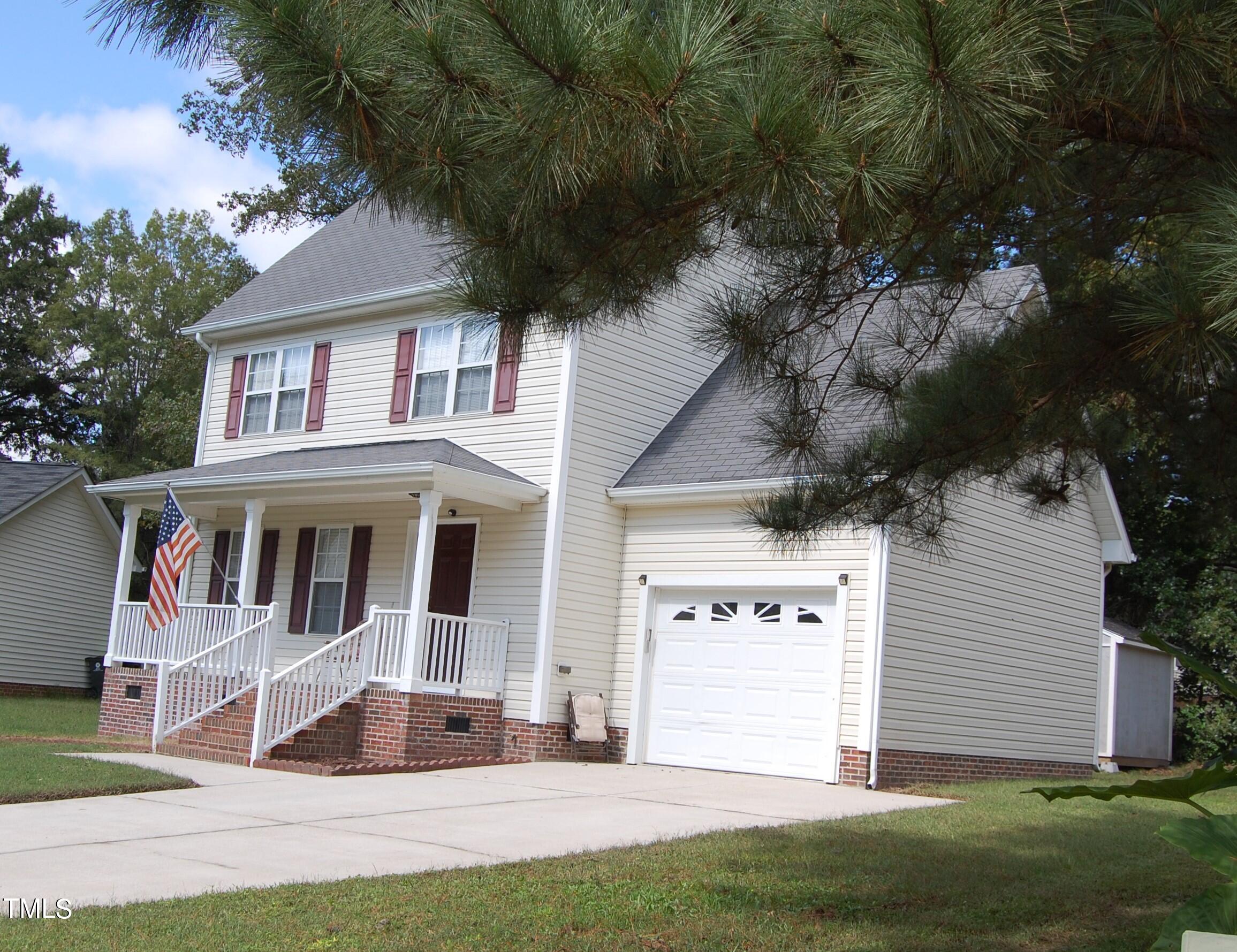 a view of house with yard