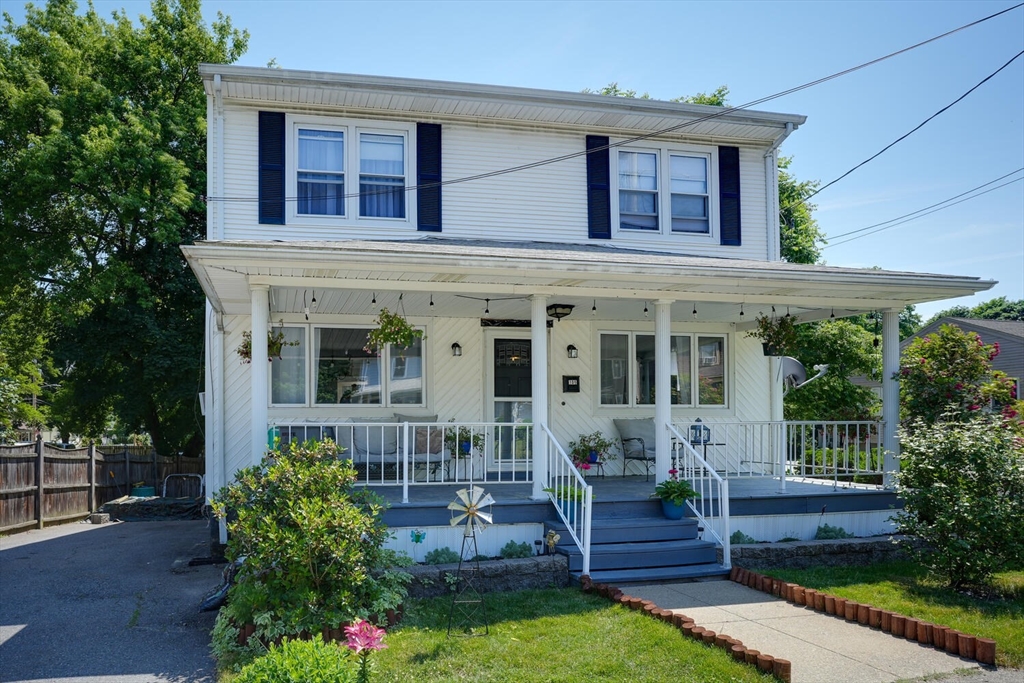 front view of a house with a yard