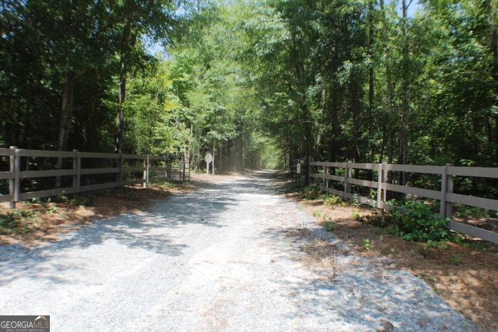 a view of outdoor space with wooden fence