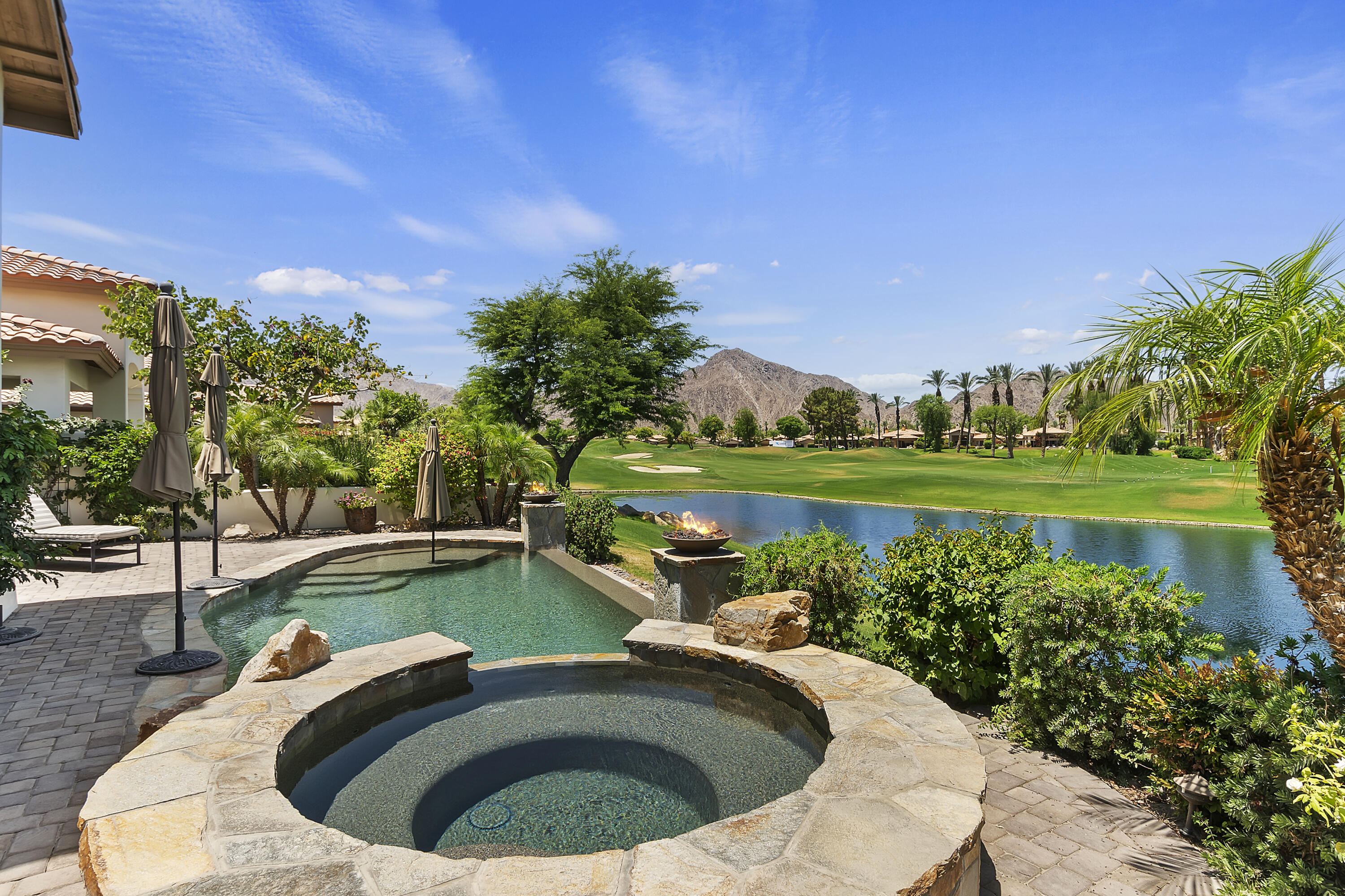 a view of a swimming pool with a lake view