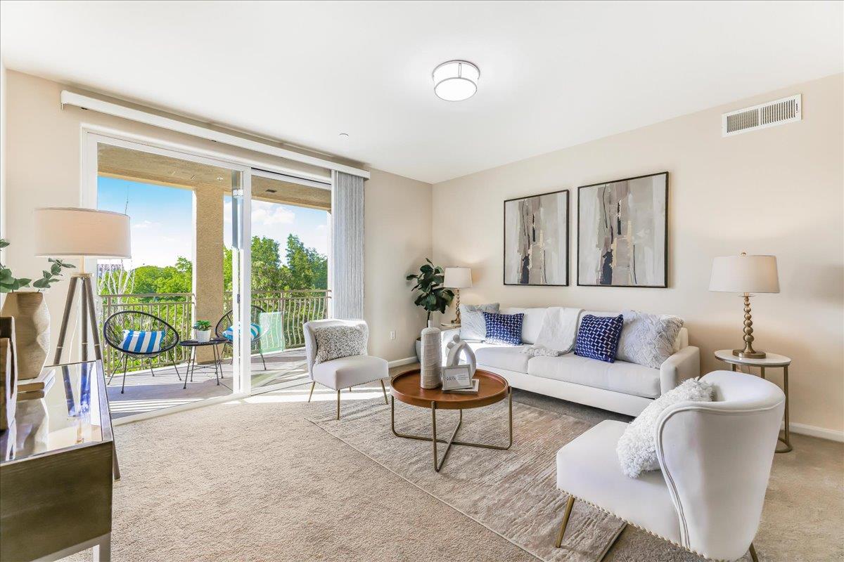 a living room with furniture and a large window