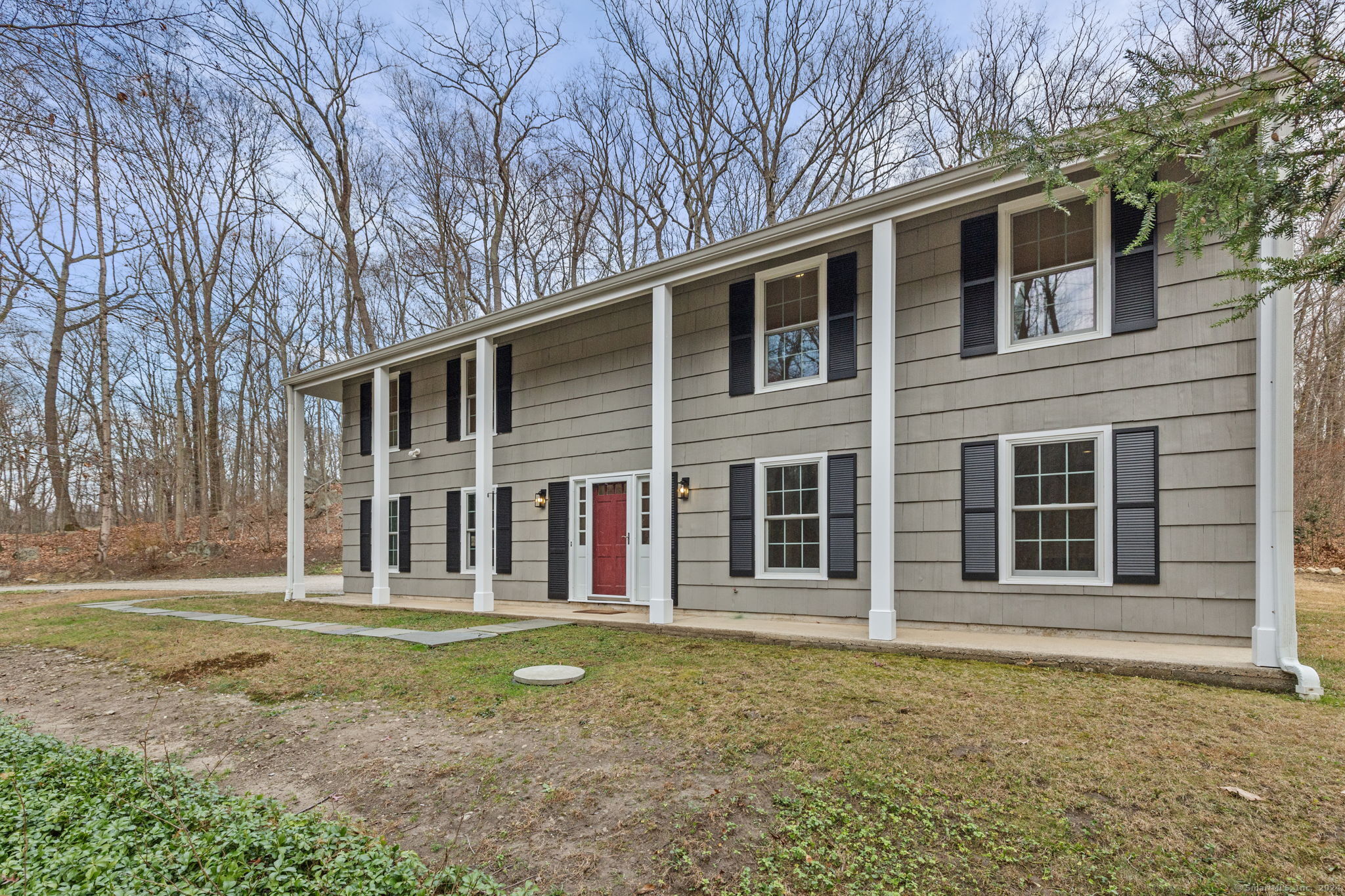 a front view of a house with a yard