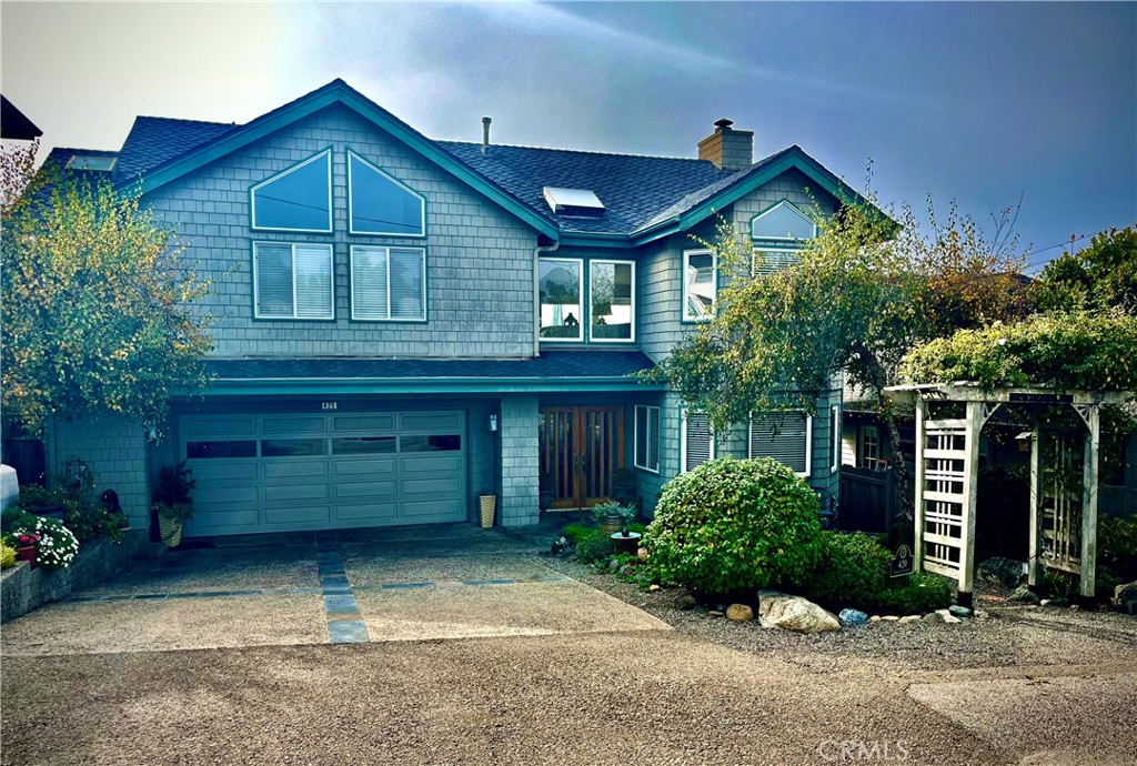 a front view of a house with garage