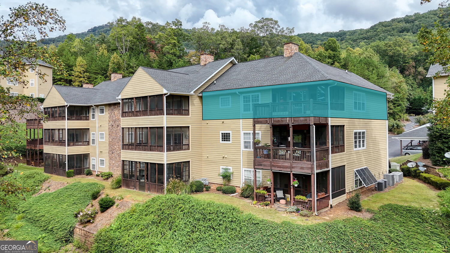 a aerial view of a house with yard and plants