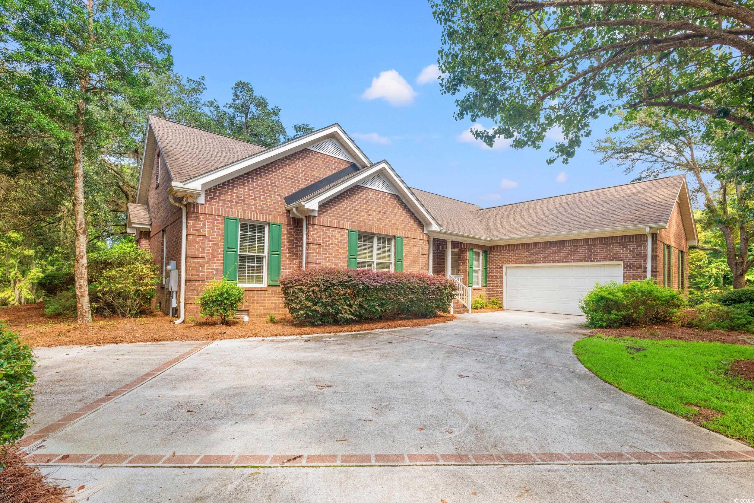 View of front of property with a garage