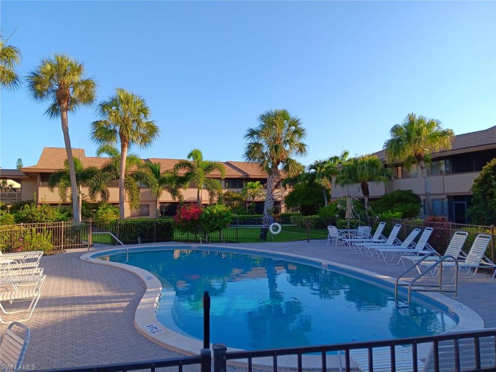 a view of a patio with swimming pool