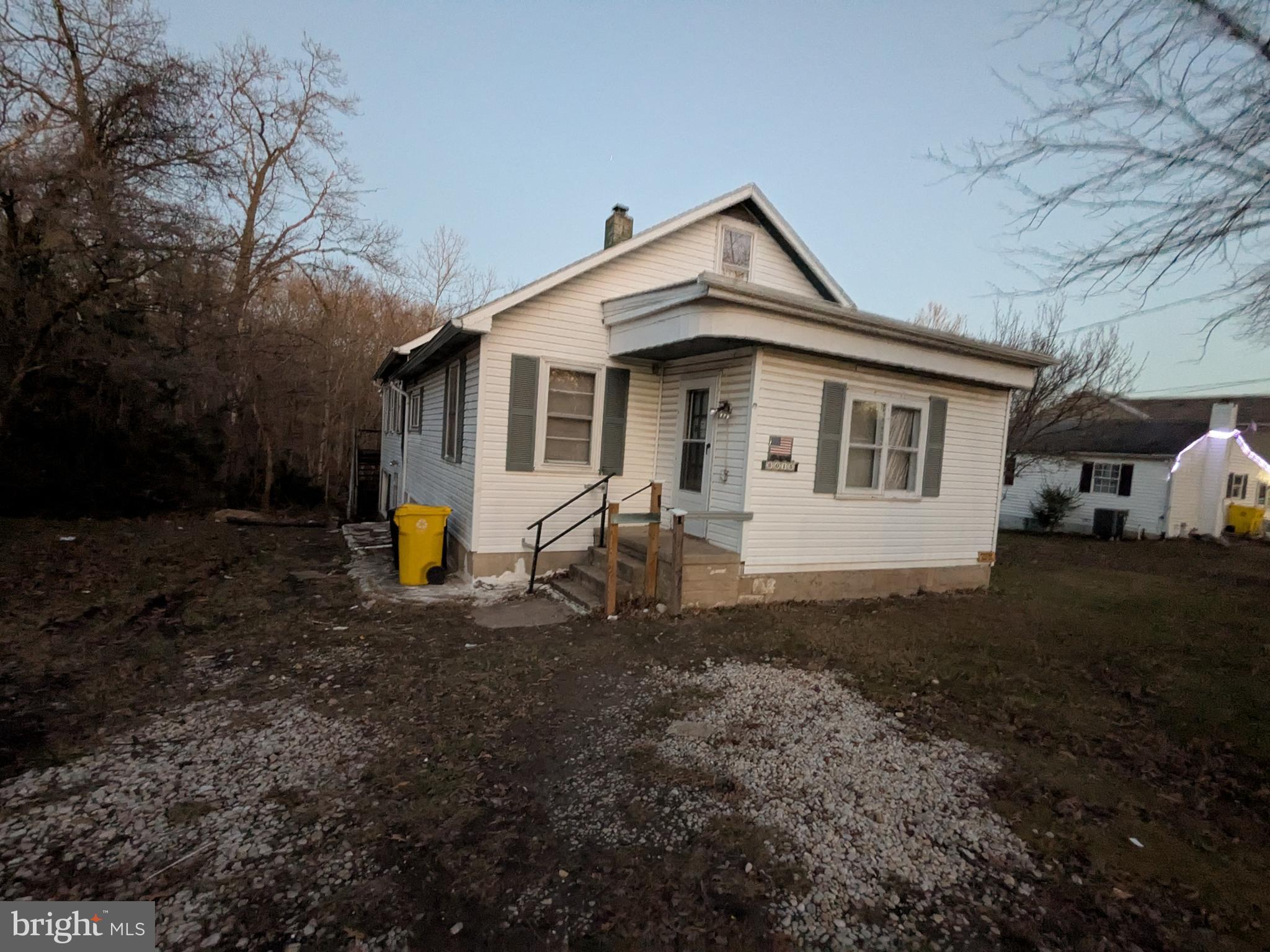 a view of a small white house