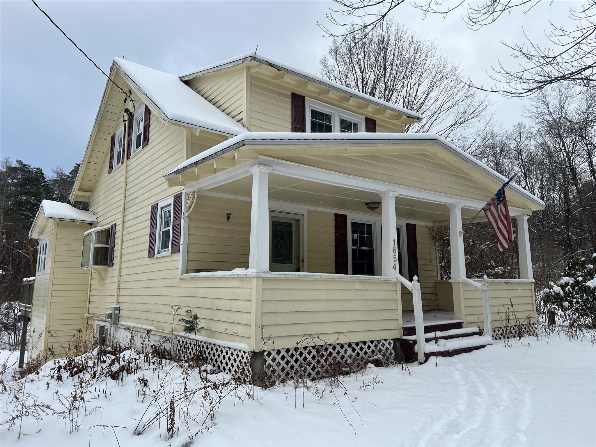 View of front of home featuring covered porch