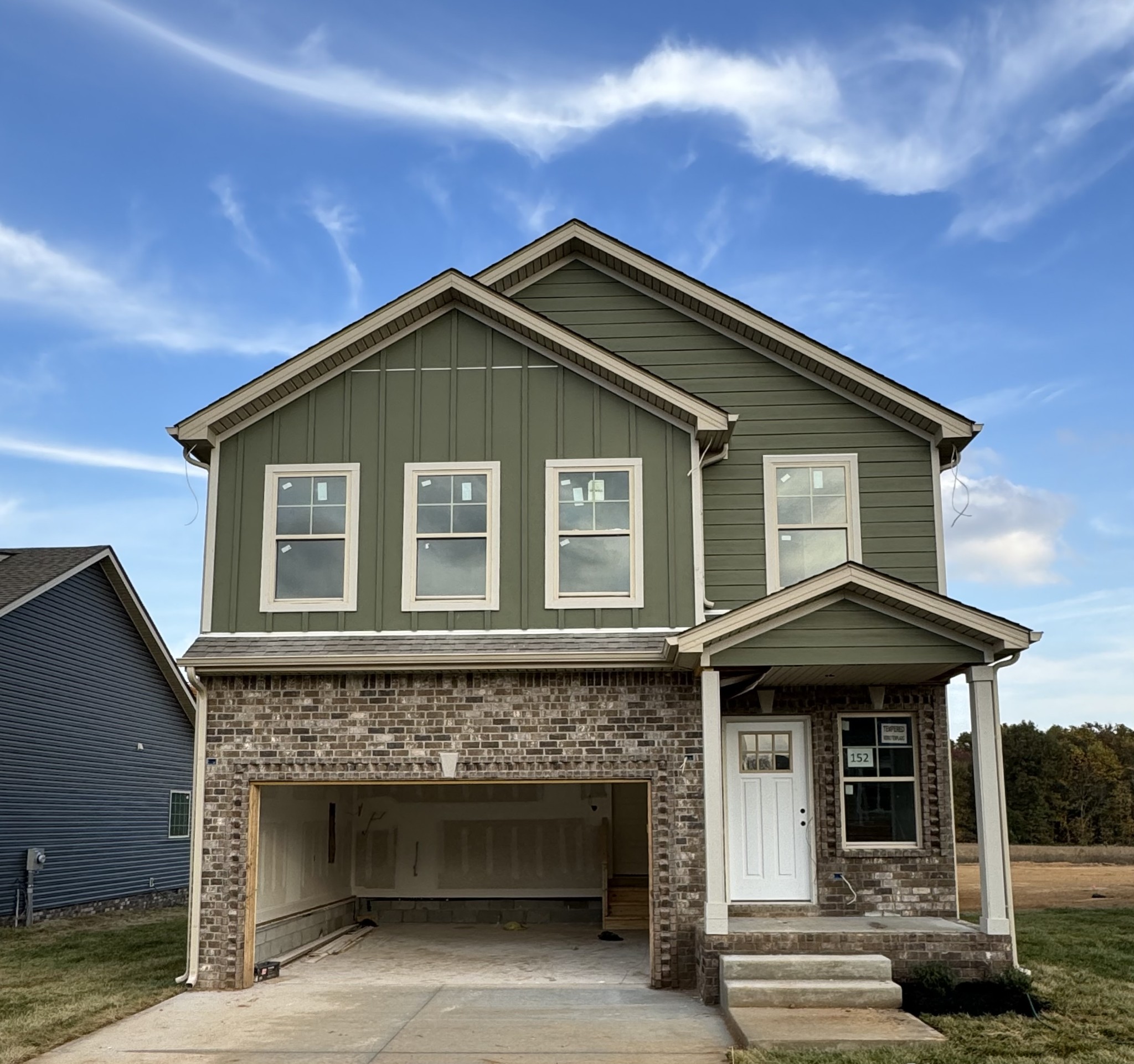 a front view of a house with yard