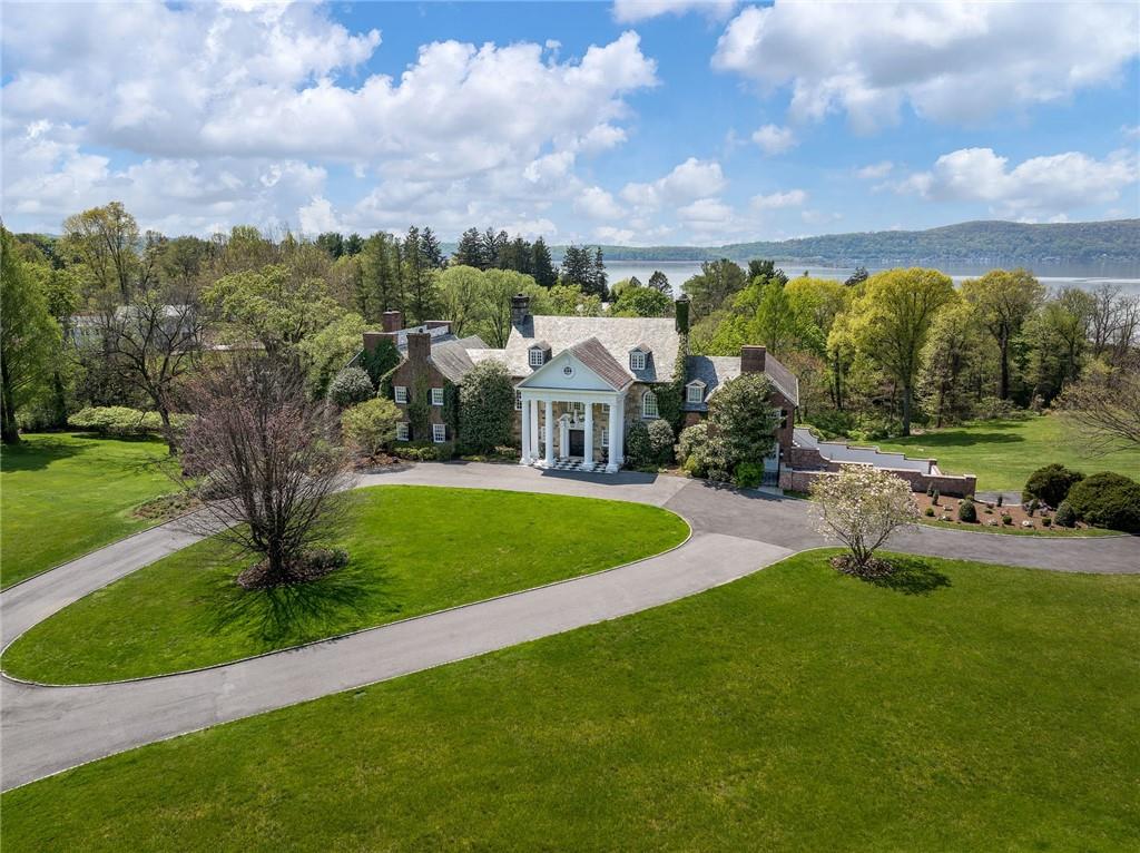 Circular drive leads to 12 spectacular and gated acres on the Hudson River