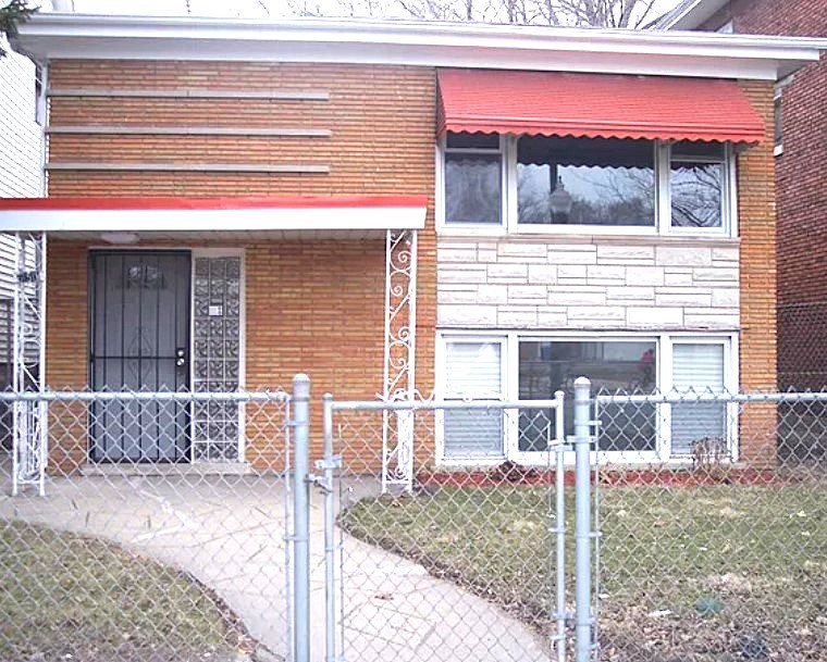 a view of a house with a door and a window