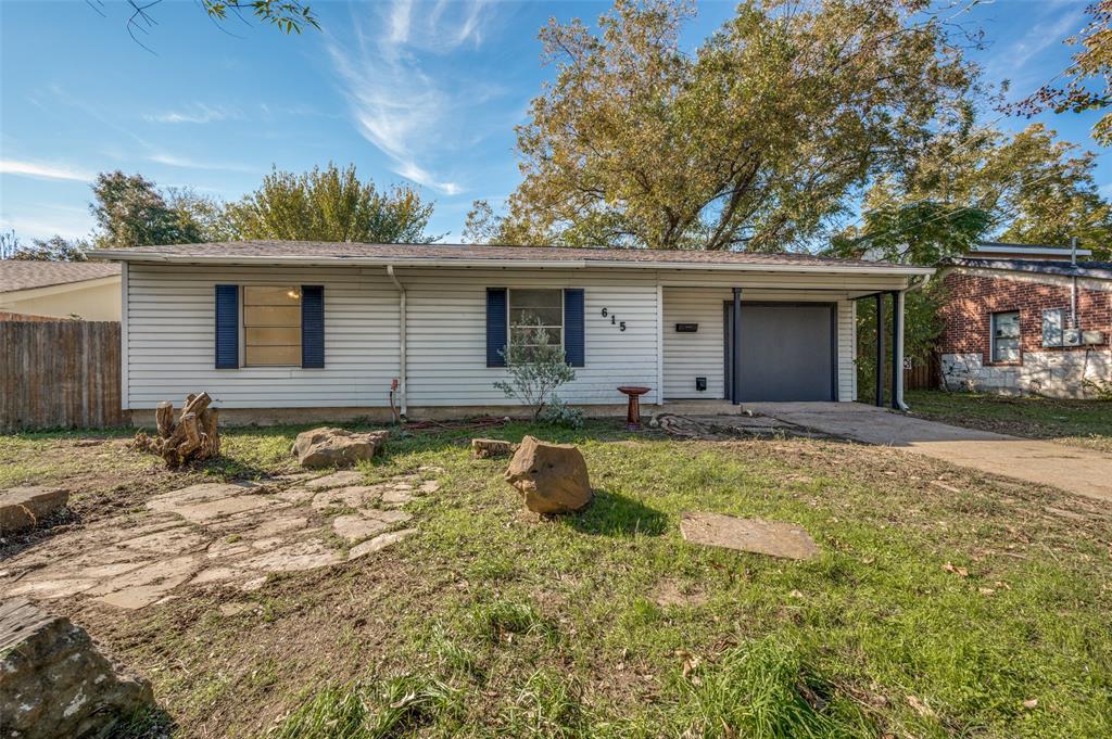 front view of a house with a yard