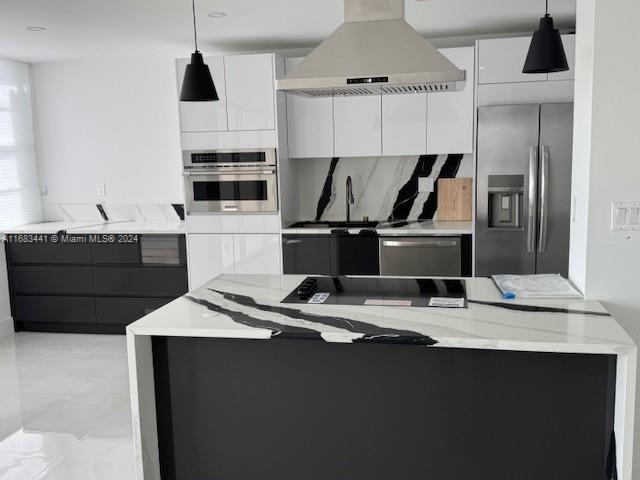 a kitchen with kitchen island granite countertop a sink and a stove