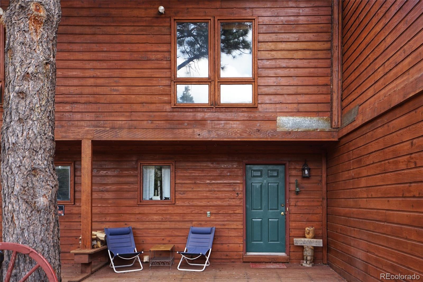 a view of outdoor seating area with brick wall