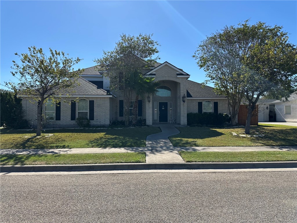 a front view of a house with a yard