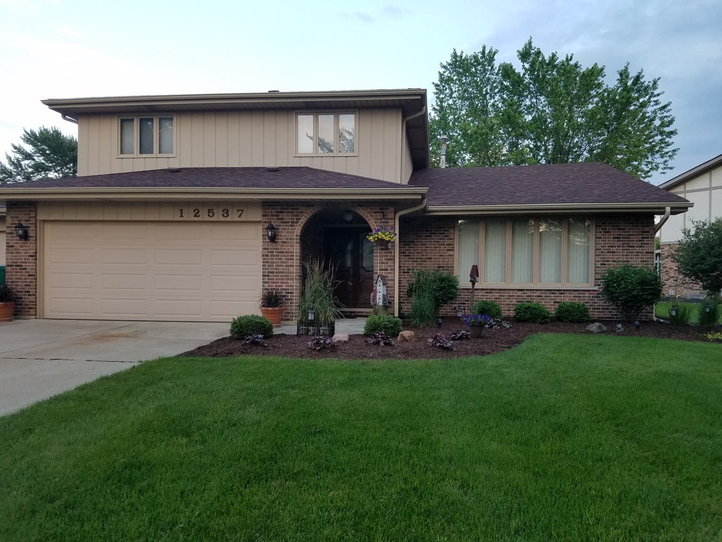 a view of a house with patio and yard