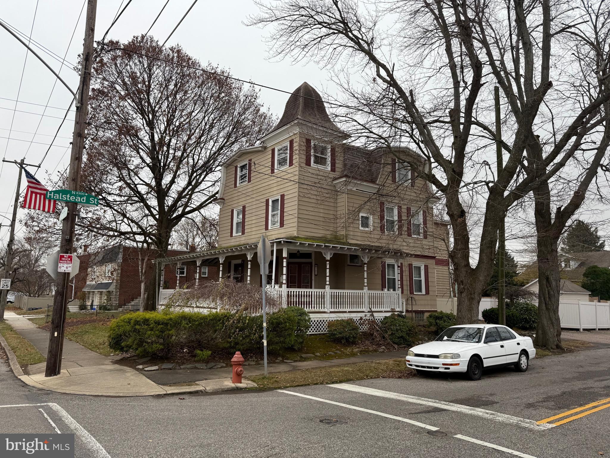 a car parked in front of a houses