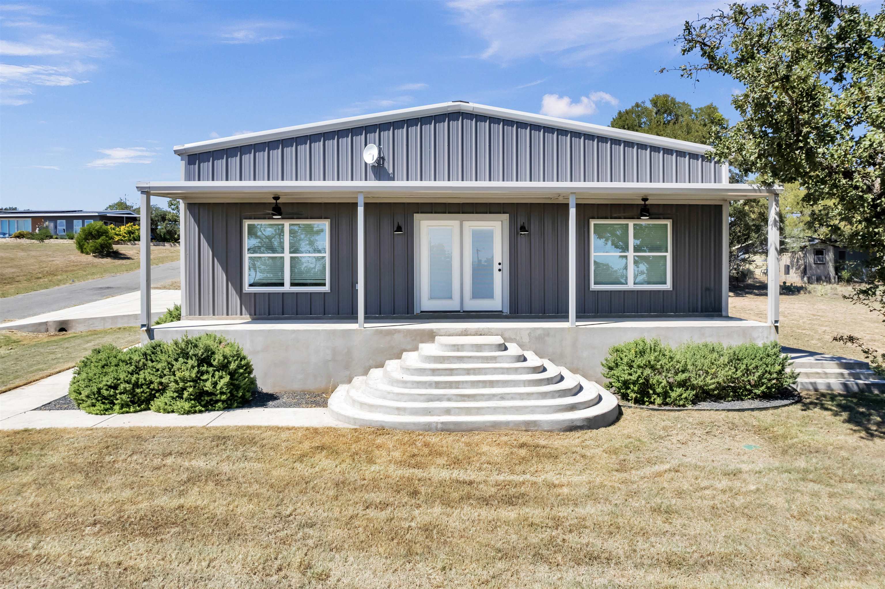 a front view of a house with a yard