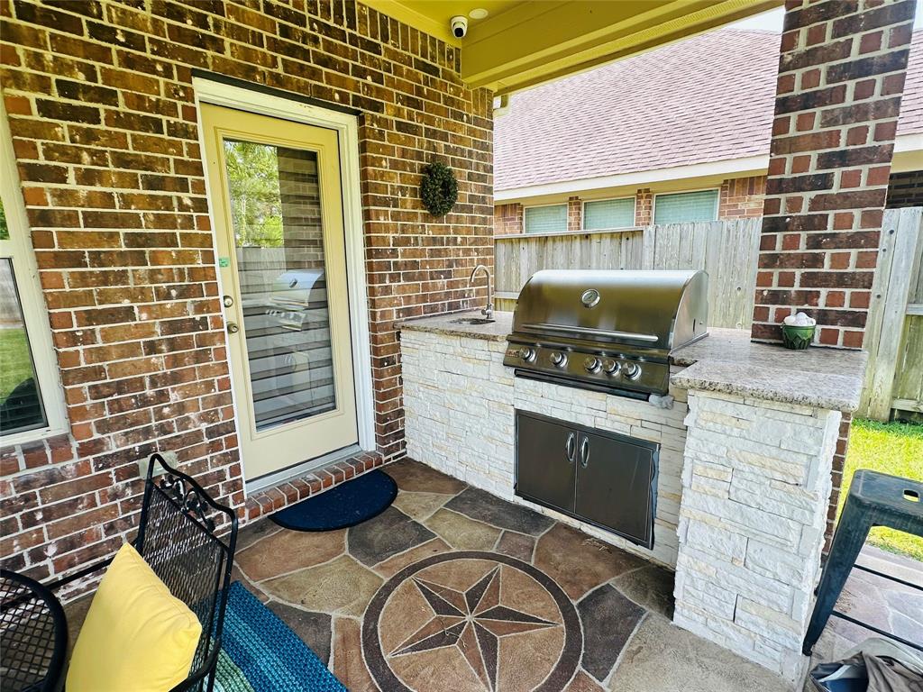 a stove top oven sitting inside of a kitchen