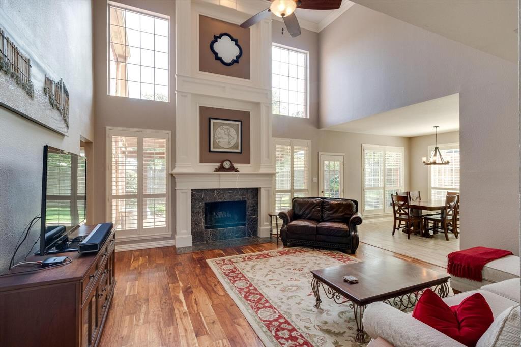 a living room with furniture fireplace and window