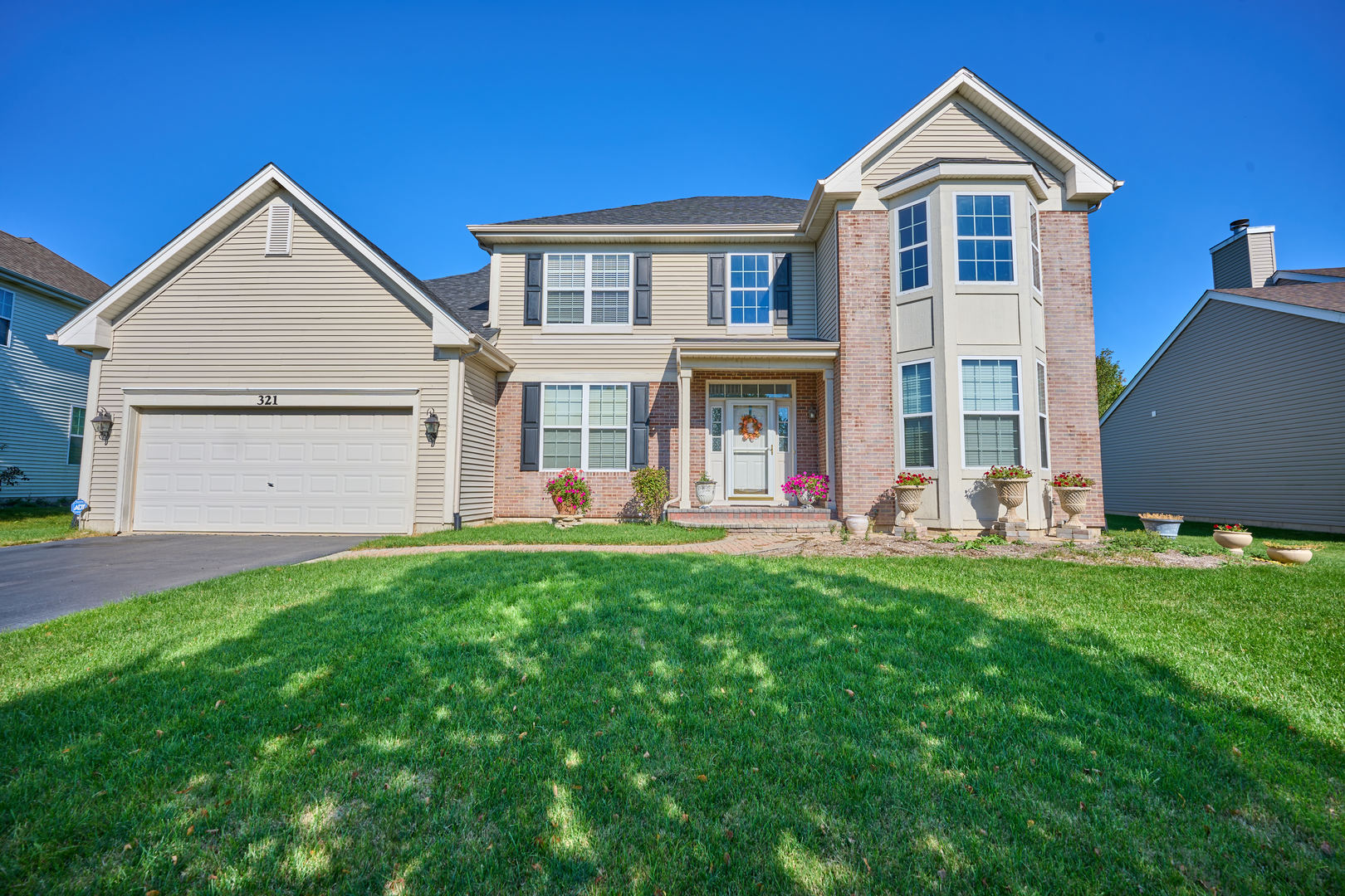 front view of a house with a yard