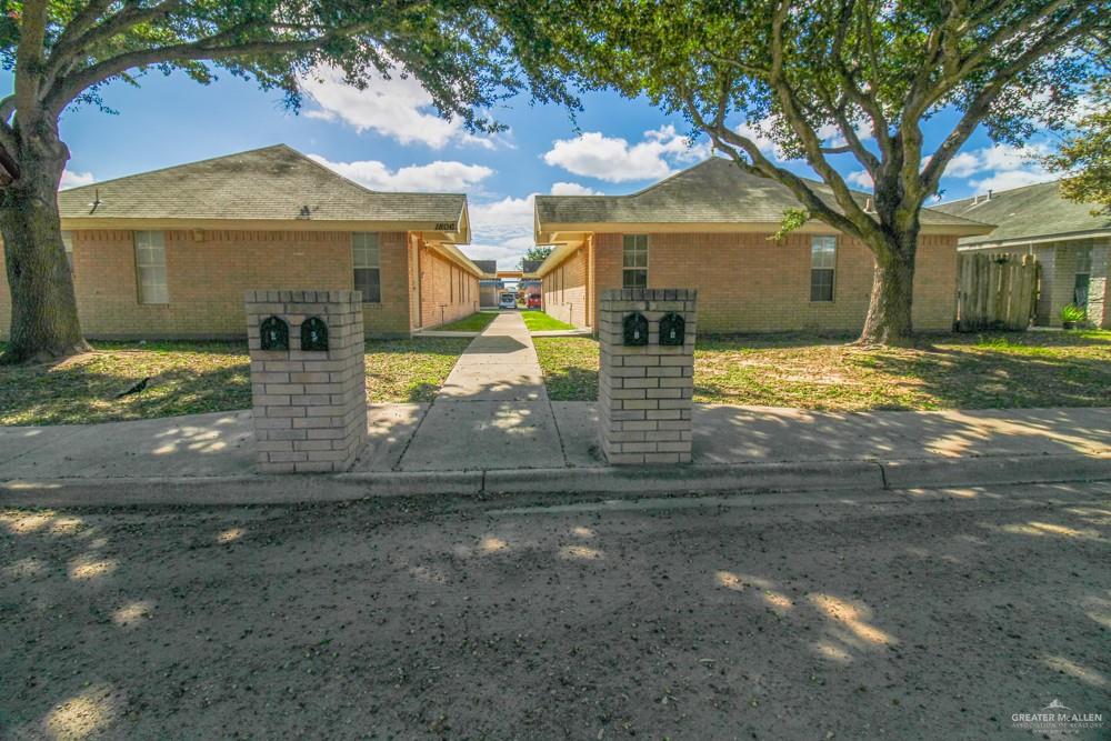 a view of a house with a yard