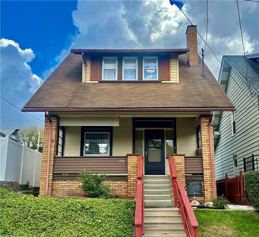 a front view of a house with a porch