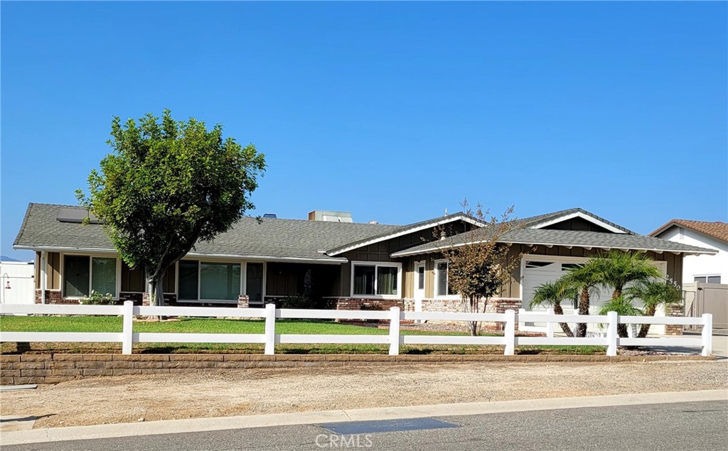 a front view of a house with a small yard