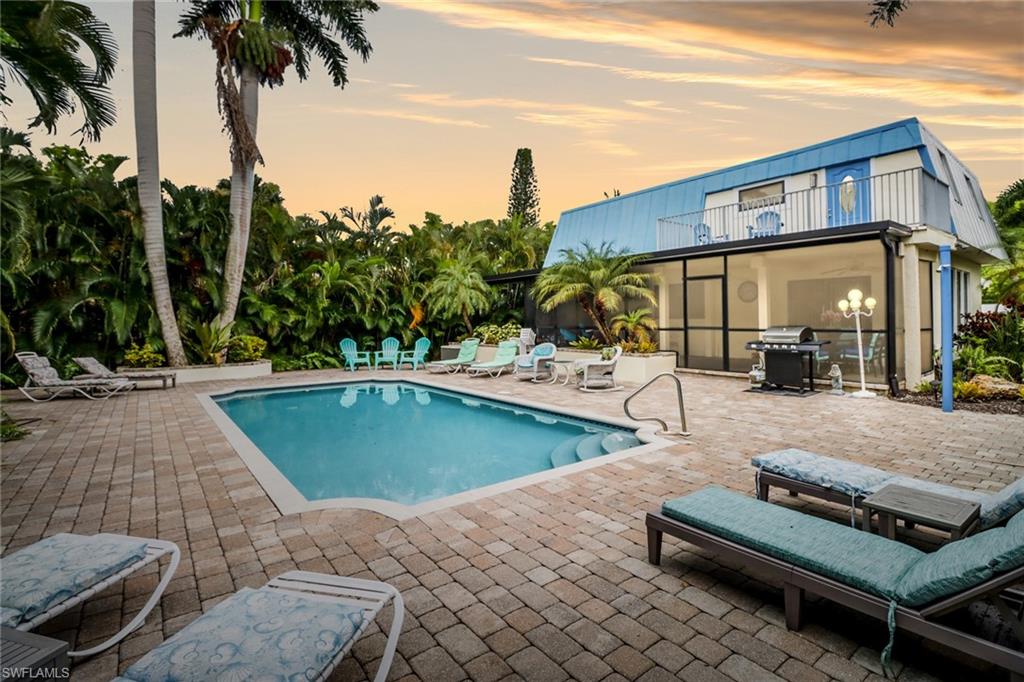 a view of a patio with swimming pool table and chairs