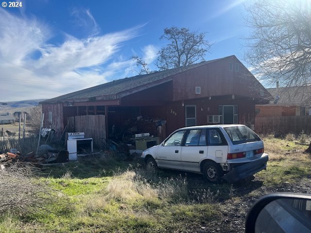 a car parked in front of a house