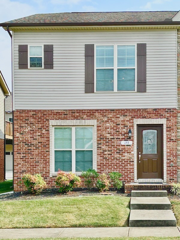 a front view of a house having yard