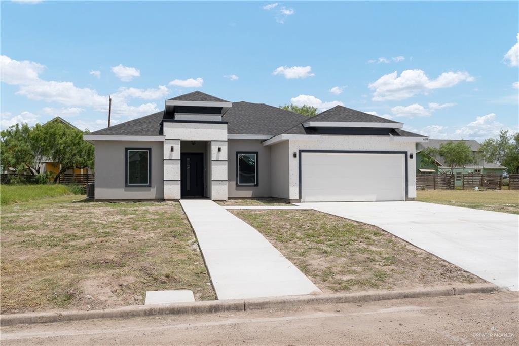 front view of a house with a yard