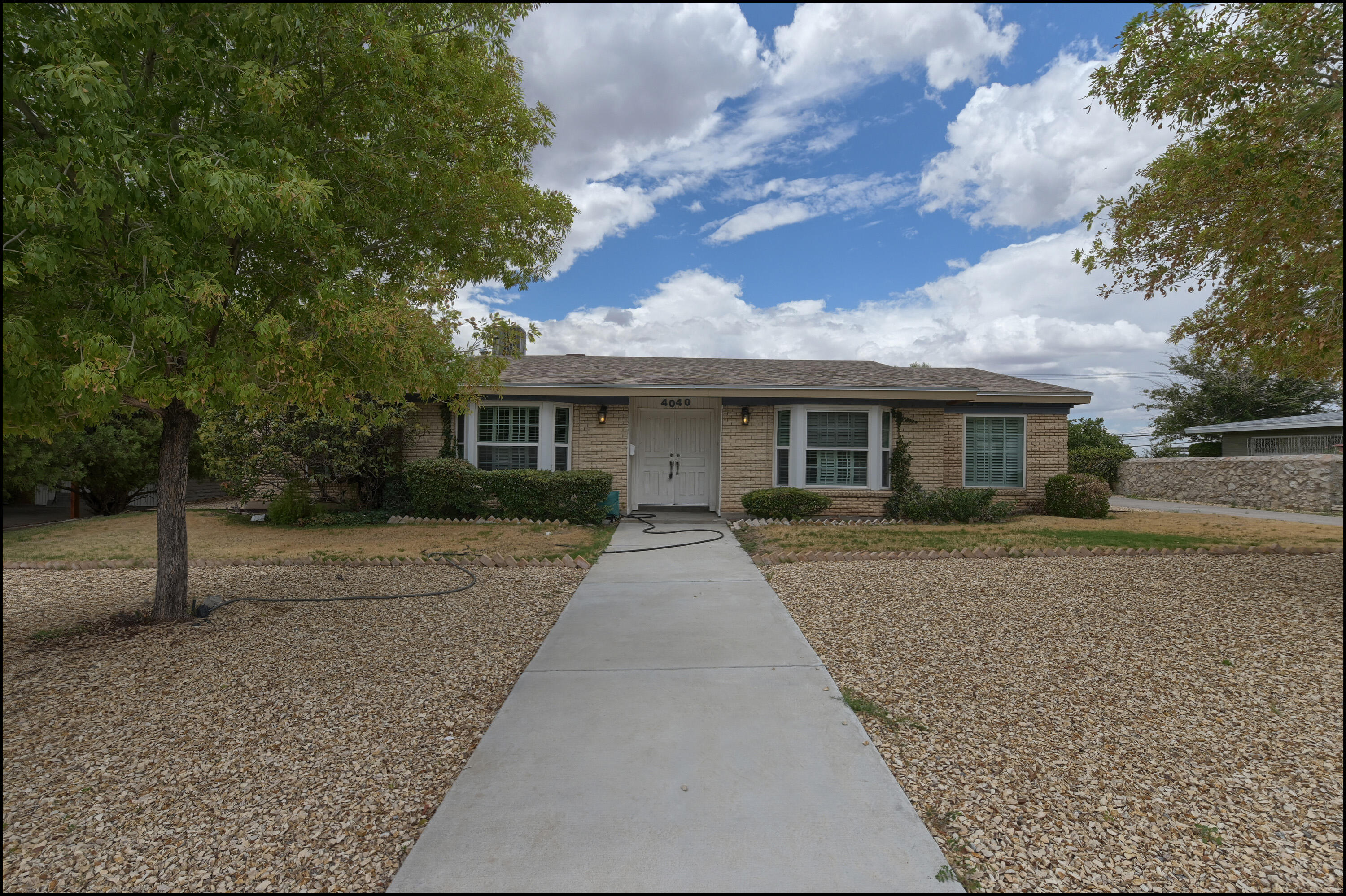 front view of a house with a yard