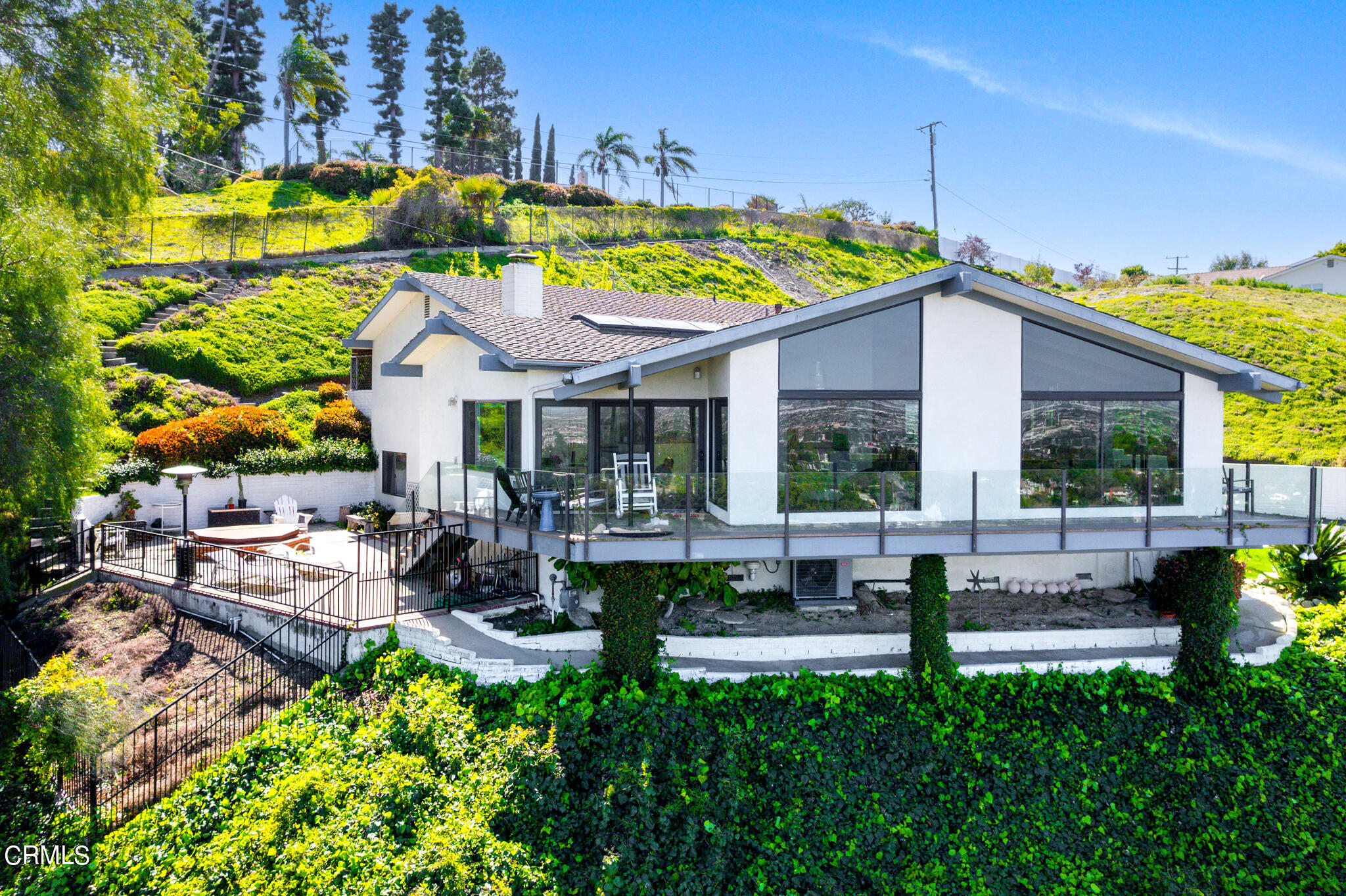 a view of an house with backyard and patio