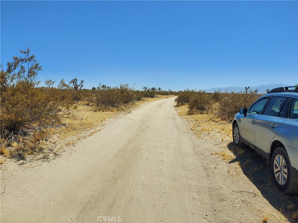 a view of a lake with a car parked in the ocean