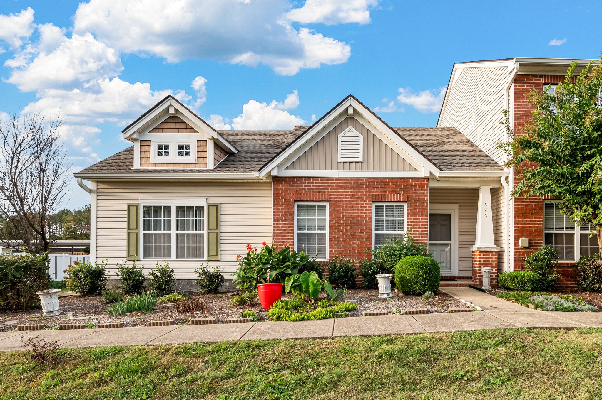 a front view of a house with a yard