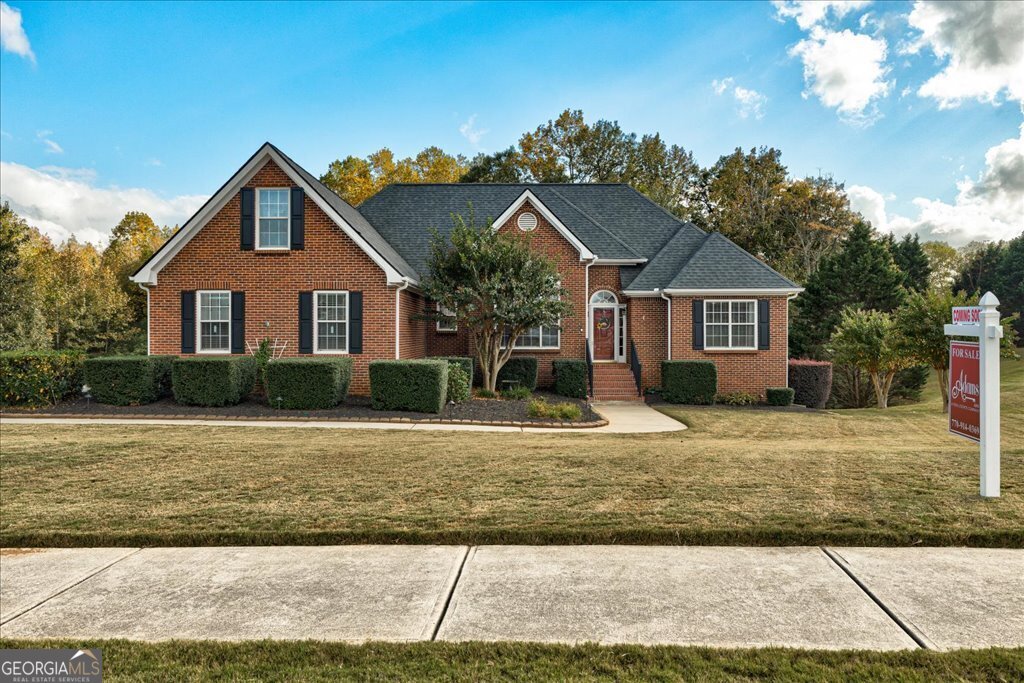 a front view of a house with a yard