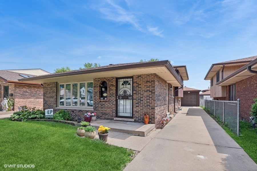 front view of house with a yard