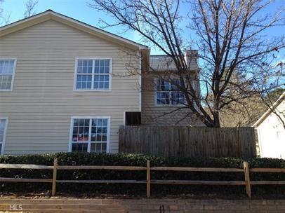 a front view of a house with stairs