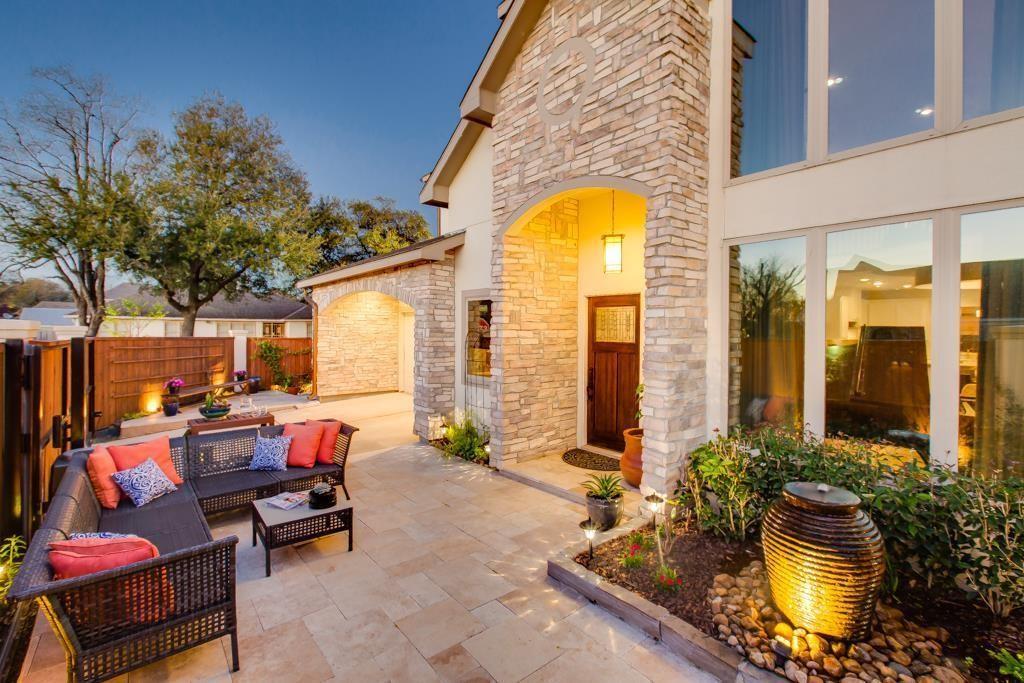 a swimming pool with outdoor seating and yard