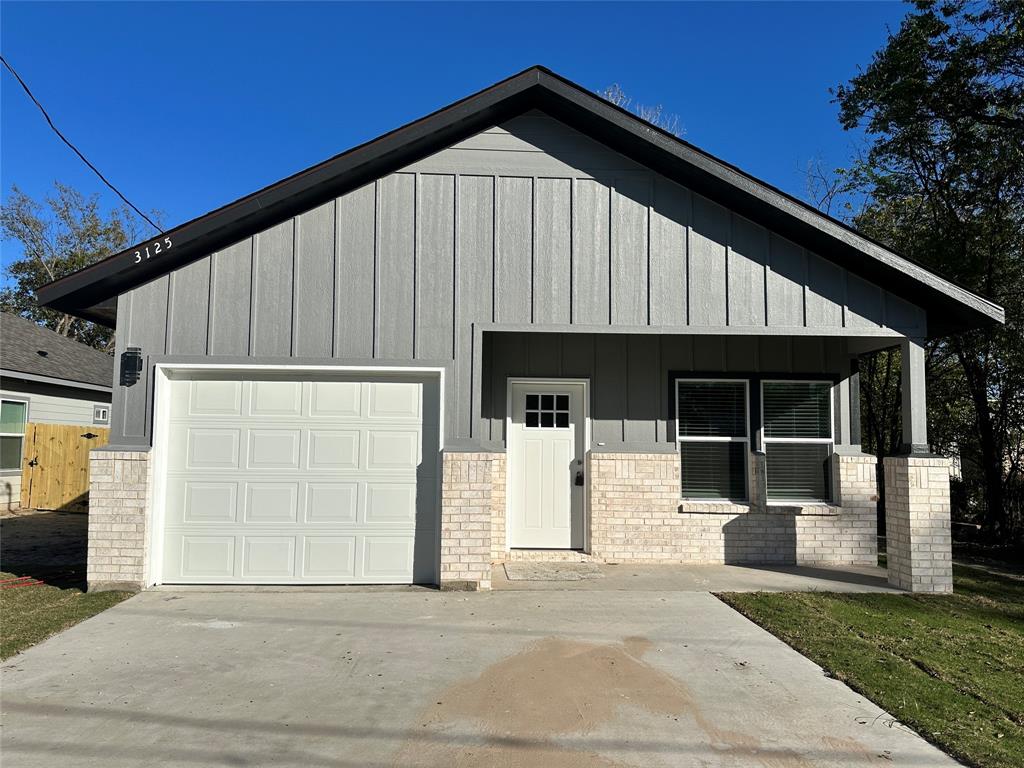 a view of a house with a garage