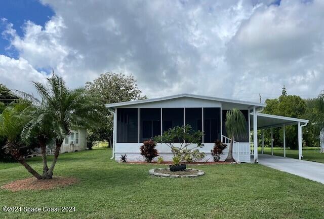 a front view of a house with garden and porch