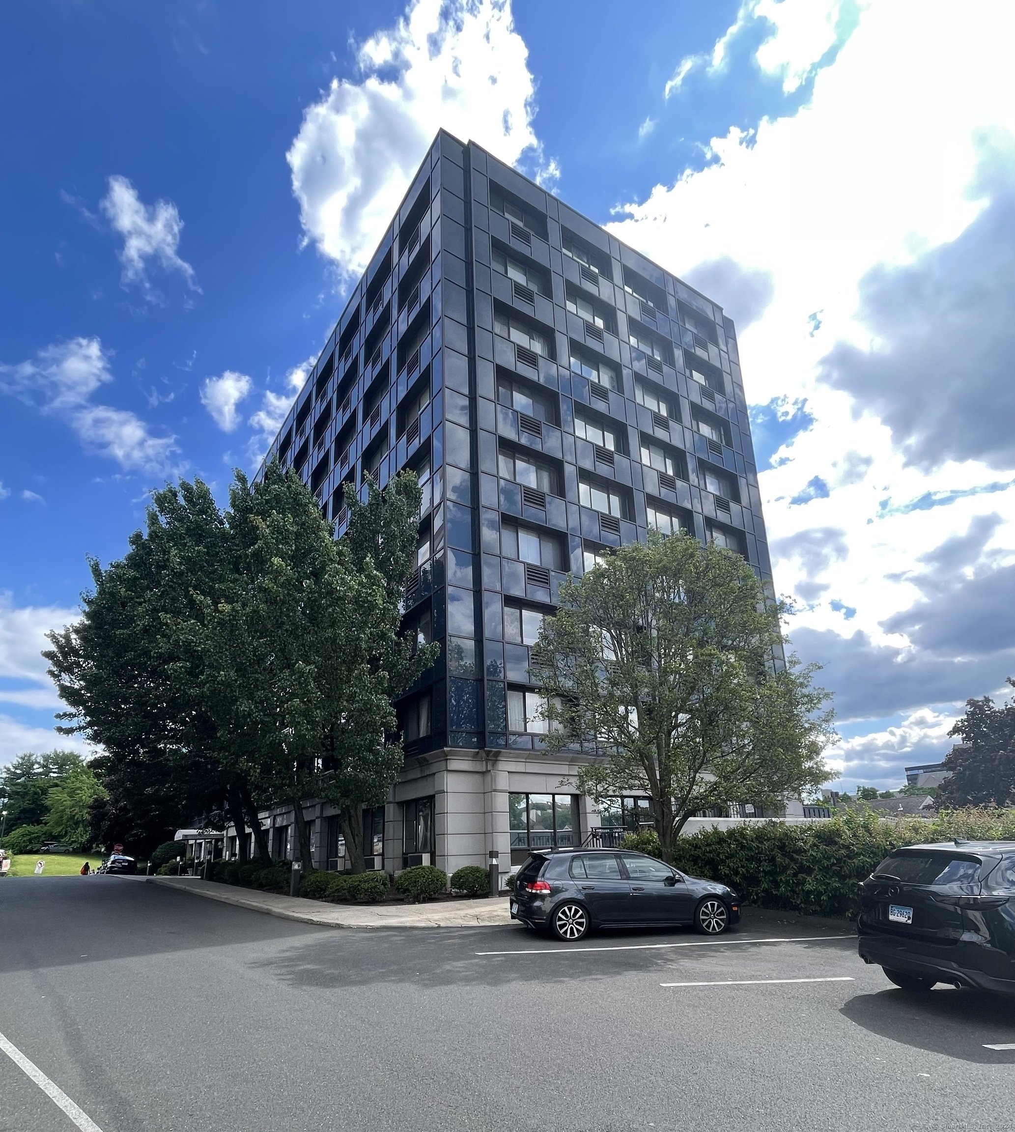 a view of a parked cars in front of a building