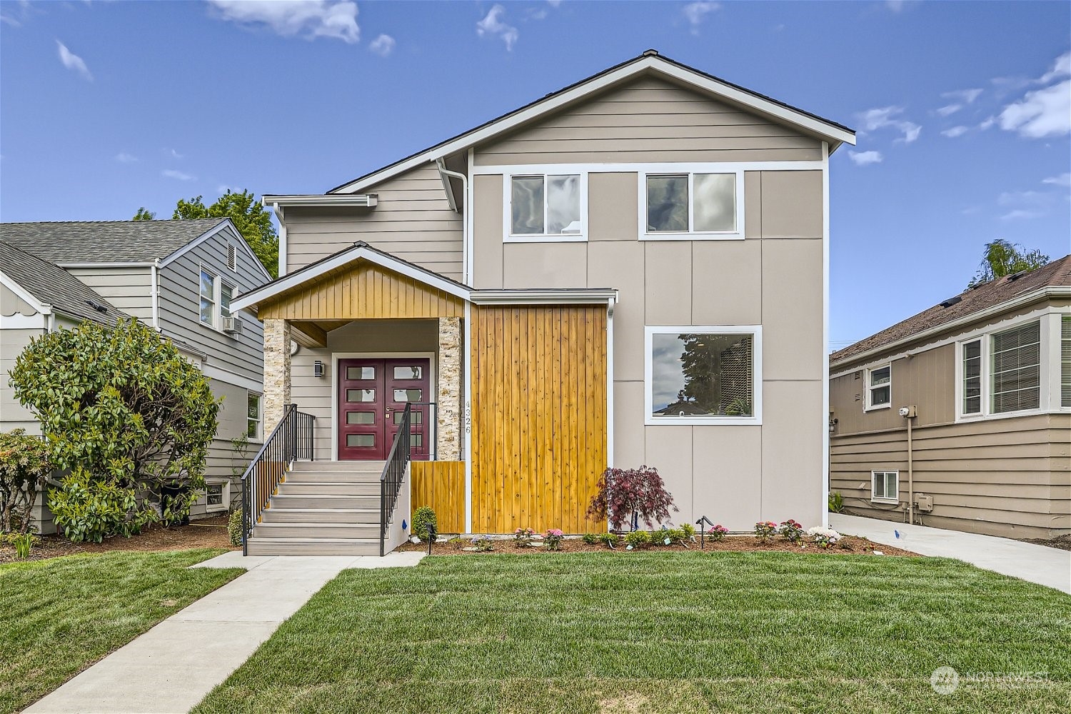 a front view of a house with a yard