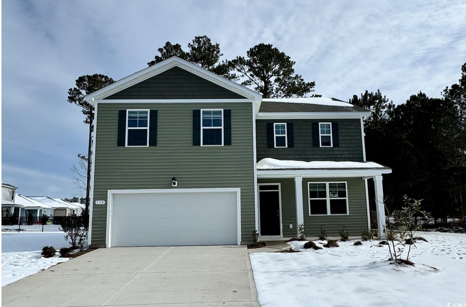 View of front property with a garage