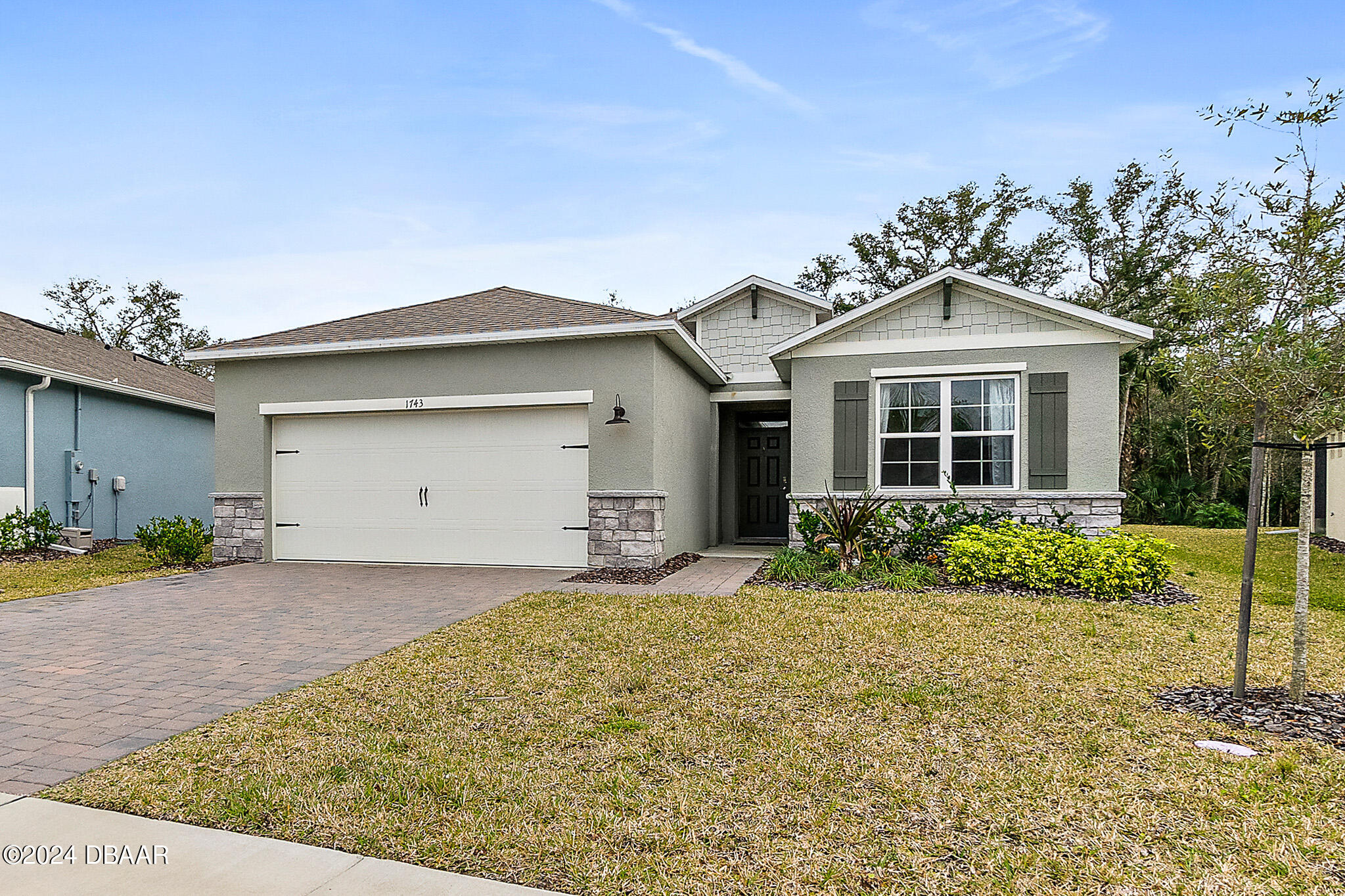 front view of a house with a yard