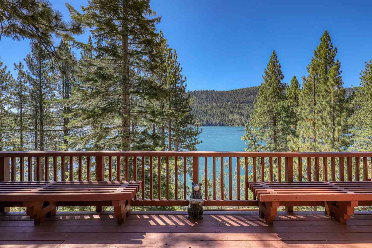 a wooden bench sitting on top of a wooden deck