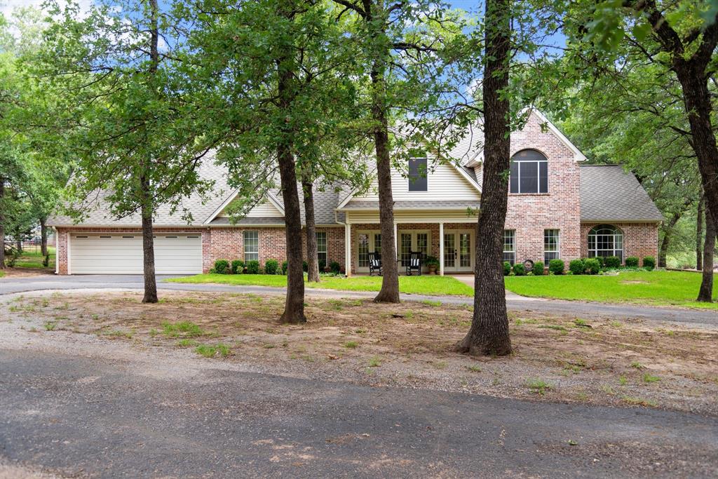 a house with a tree in front of it