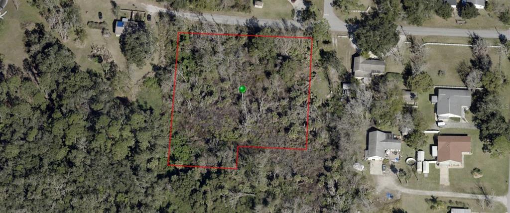 an aerial view of residential house with parking space